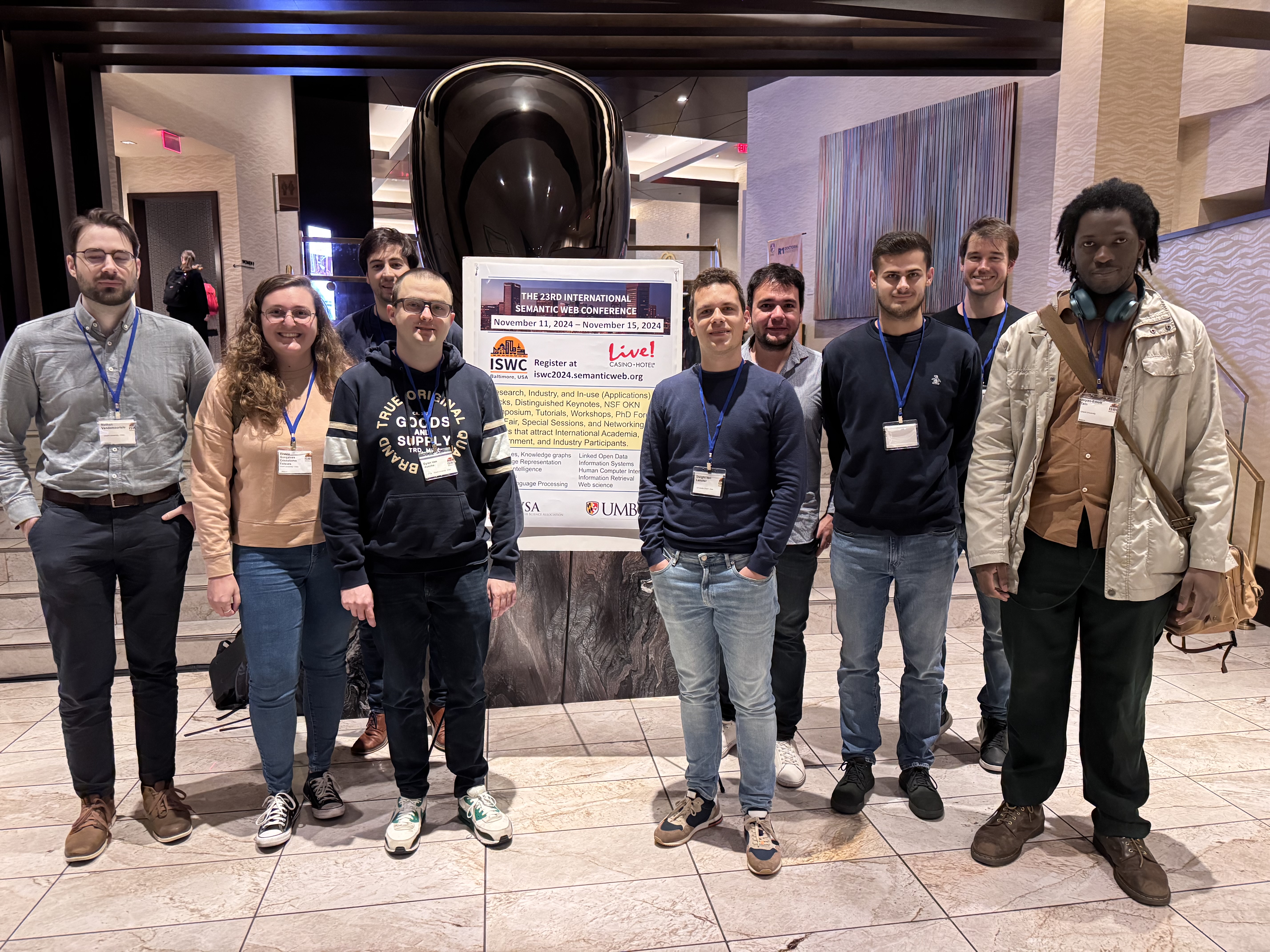 A group picture of the KNoWS people who joined ISWC 2024. From left to right: TODO, Beatriz, Bram, Dylan, Dwight, Juliàn, Wout, Pieter B, Brian